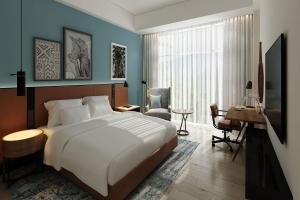 A bed or beds in a room at Four Points by Sheraton Kampala