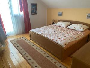 Una cama o camas en una habitación de Apartman Zeko