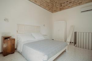 Postel nebo postele na pokoji v ubytování La Torre Vasto B&B