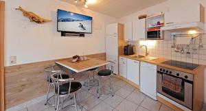 Kuchyňa alebo kuchynka v ubytovaní Apartment Rossbichl