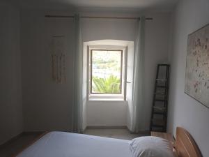 Postel nebo postele na pokoji v ubytování Apartment penthouse & apartment studio Franci