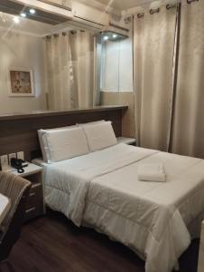 Ein Bett oder Betten in einem Zimmer der Unterkunft Hotel Bonnel Confort - Rede Bonnel Tropical