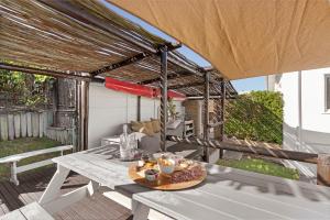 a table with a tray of food on a patio at Sea View Hilltop Villa, Blouberg in Cape Town