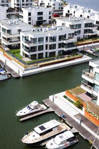 two boats docked at a dock in a harbor at GRANO HOTEL Solmarina in Wiślinka