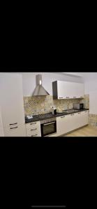 Kuchyň nebo kuchyňský kout v ubytování Rooms San Leonardo