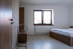 Postel nebo postele na pokoji v ubytování Penzion Tonička