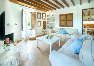 a living room with a couch and a table at Son March Petite in Pollença
