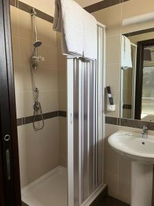 a bathroom with a shower and a sink at B&B Villa Anna in Sibari