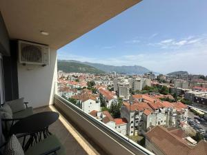 a balcony with a view of a city at Penthouse NIKOLA in Budva