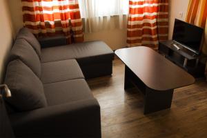a living room with a couch and a coffee table at Apartment Kranevo in Kranevo