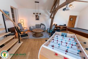 a living room with a pool table at LA GOUTTE D'OR in Avize