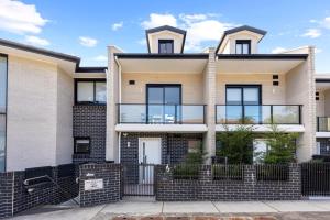 an image of a house in a suburb at modern 3 bedroom townhous in Ashfield in Sydney