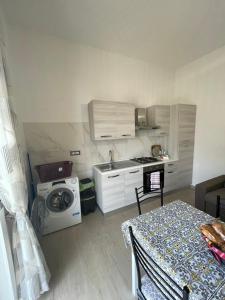a kitchen with a table and a stove top oven at Mary House in Pompei +17 photos