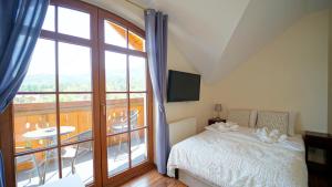 Posteľ alebo postele v izbe v ubytovaní Apartamenty EverySky - Obrońców Pokoju 1D