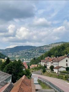 a view of a town with a road and houses at Appartement 6/8 pers Le Petit Bertin in La Bresse