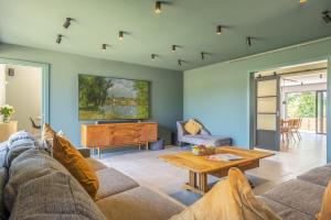 a living room with a couch and a table at The Grain Store in Reepham