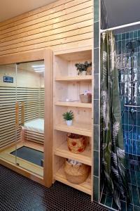 a sauna room with wooden walls and wooden shelves at Villa Adèle, vue mer, sauna et plage in Mers-les-Bains