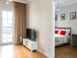 Postel nebo postele na pokoji v ubytování Apartament Bulwar Staromiejski Stare Miasto Centrum