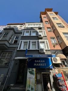 a building with a sign for a farmers market at baran suites in Istanbul