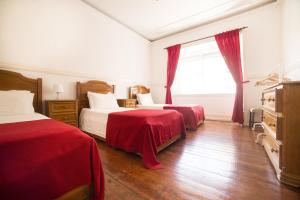 Ein Bett oder Betten in einem Zimmer der Unterkunft Residencial Valentina