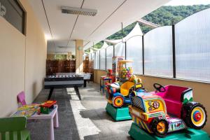 a room filled with lots of different types of toys at Hotel Fontaine Bleue in Orta San Giulio