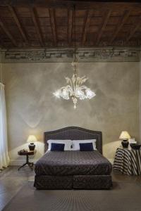 Ένα ή περισσότερα κρεβάτια σε δωμάτιο στο Albergo Cappello