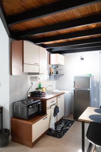 A kitchen or kitchenette at Minimal loft at Kastellokampos