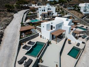 an aerial view of a villa with a swimming pool at Arise Suites in Imerovigli