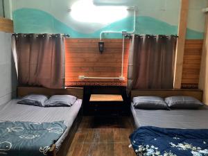 Postel nebo postele na pokoji v ubytování โรงแรมคุ้มเดช - KoomDech Hotel