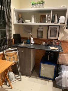 a kitchen with a sink and a counter top at Big Home in London, Forest Hill in London