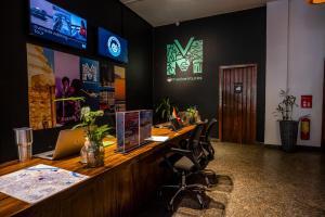 an office with a desk with a laptop on it at Mad Monkey Hostel Phnom Penh in Phnom Penh