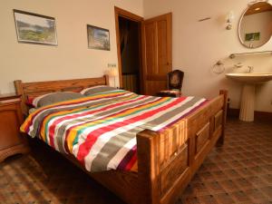 a bedroom with a wooden bed and a sink at Spacious holiday home in Vicchio with private Pool in Vicchio