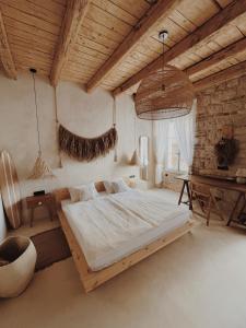 a bedroom with a bed in a room with a table at LISSA home in Vis