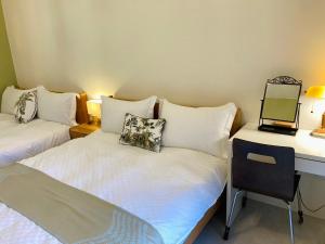 Tempat tidur dalam kamar di 心適都蘭Comfy Inn, Dulan