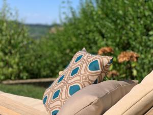 a pair of pillows sitting on top of a bench at Ferienwohnung Panorama - Suite in Kappelrodeck