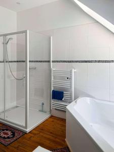 a white bathroom with a shower and a tub at Room in Guest room - Vilmorais Rooms 
