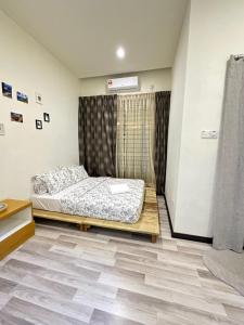 En eller flere senge i et værelse på 一间民宿 A Homestay