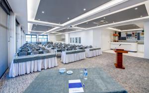 a room with rows of chairs and a podium at Bera Konya Hotel in Konya