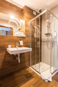 a bathroom with a sink and a shower at Hotel Wisła Premium in Wisła