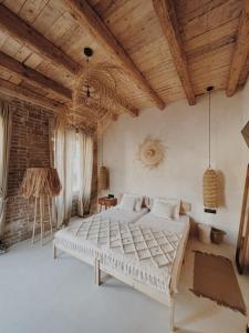 a bedroom with two beds and a brick wall at LISSA home in Vis