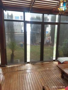 a screened in porch with a large window at Marbella Beach îlot 5 in Mansouria