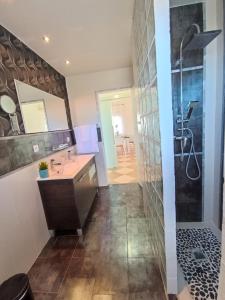 a bathroom with a shower and a sink at Villa del Sol in Benalmádena