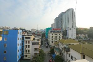 a view of a city with tall buildings at Hotel Sunny HG in Ha Long