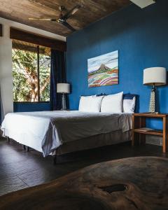 Postel nebo postele na pokoji v ubytování Ananda Guesthouse