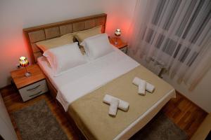 Krevet ili kreveti u jedinici u okviru objekta Royal Apartman