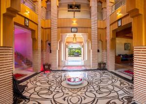 a large room with a lobby with a large rug at Villa Dar Laila in Marrakesh