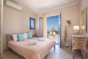 Postel nebo postele na pokoji v ubytování Cielo by Vintage Travel + 14 fotografií