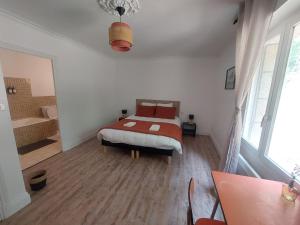 Postel nebo postele na pokoji v ubytování L'échappée, Chambres et Tables d'hôtes