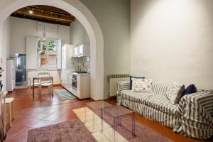 a living room with a couch and a table at Classic Loft by Mmega in Florence