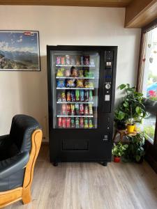 a soda vending machine with drinks in a room at Pension Steiner, Matrei am Brenner 18b, 6143 Matrei am Brenner in Mühlbachl